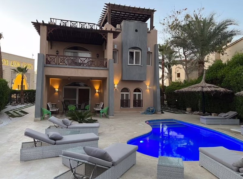 Villa A private swimming pool and garden at dusk in Nabq Bay